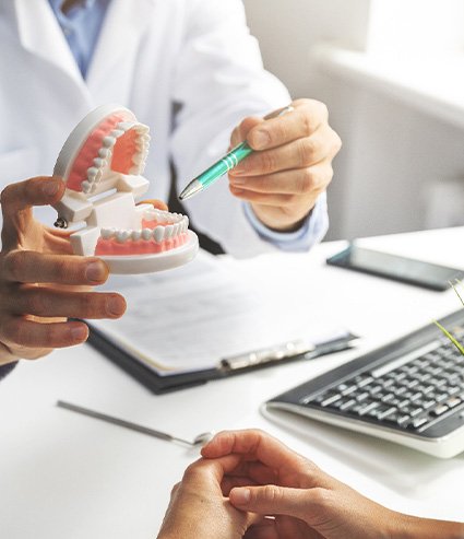 a patient during their dental implant consultation