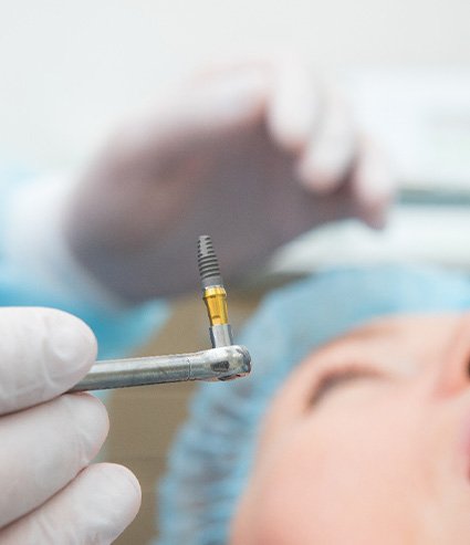 A patient having dental implant surgery
