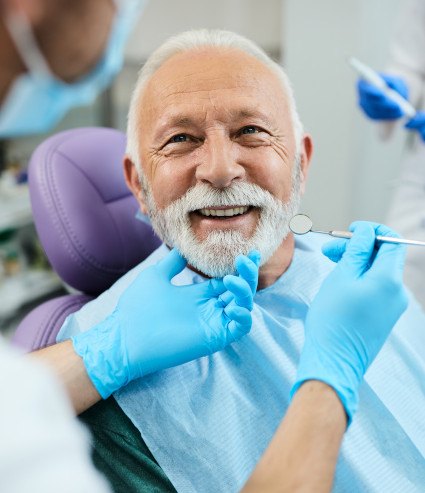 Man smiling at the dentist