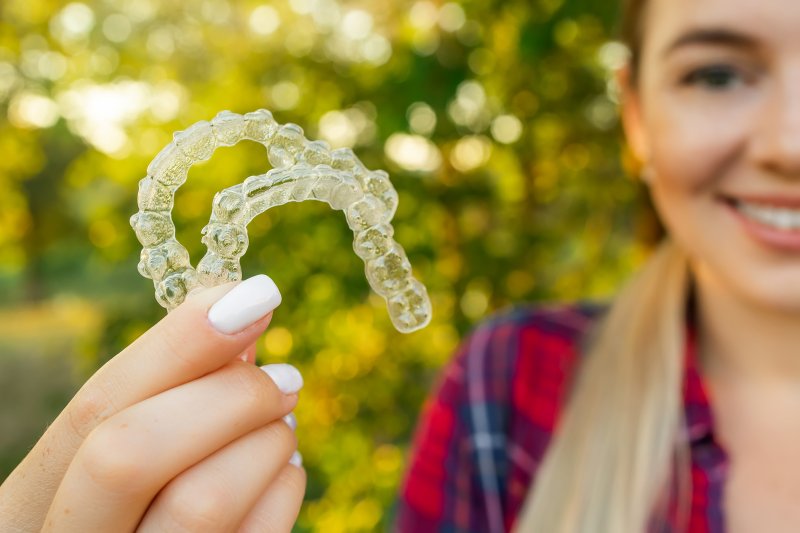 Lady shows off Invisalign aligners