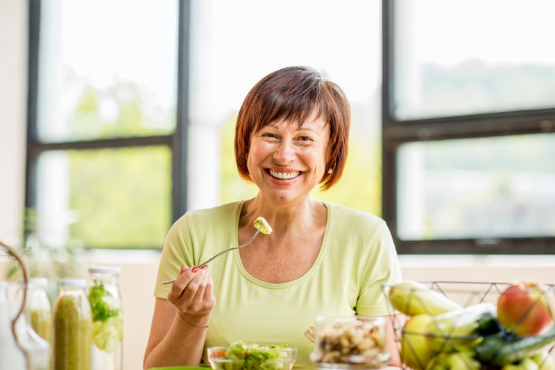 Patient eating with their dentures